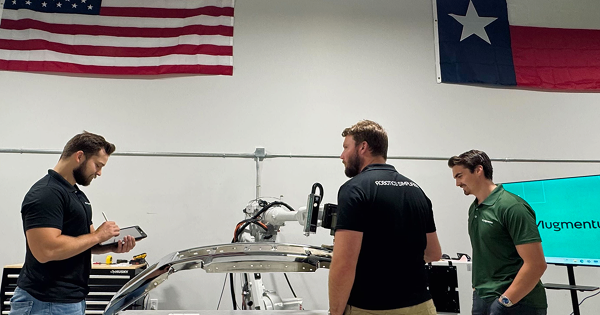 At our Texas Experience Center, the Augmentus team prepares demos to help manufacturers explore no-code automation up close.