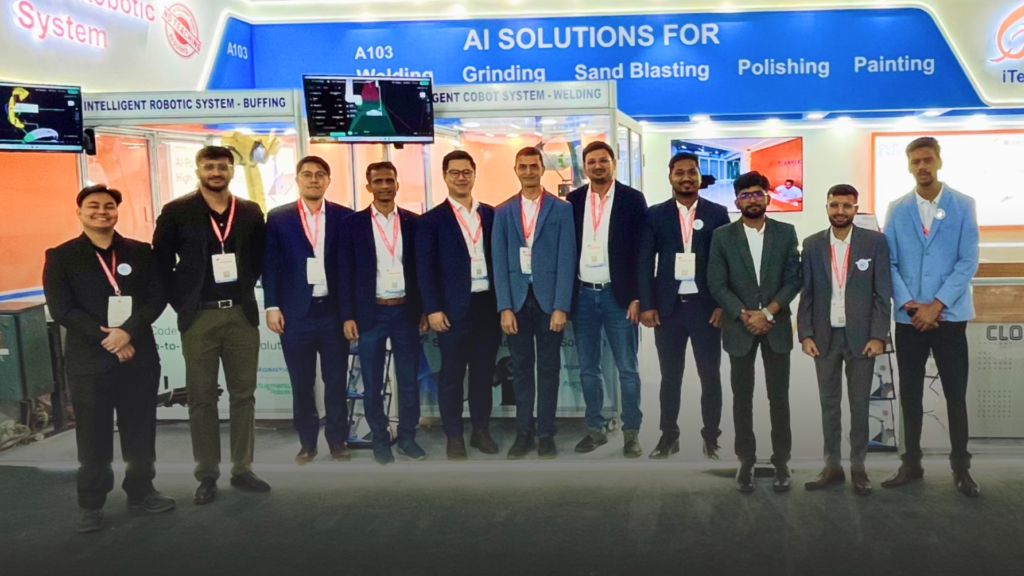 A group photo of team members from Augmentus, an AI-augmented robotics solutions provider and iRobotics, an India-based systems integrator specialising in welding and surface finishing